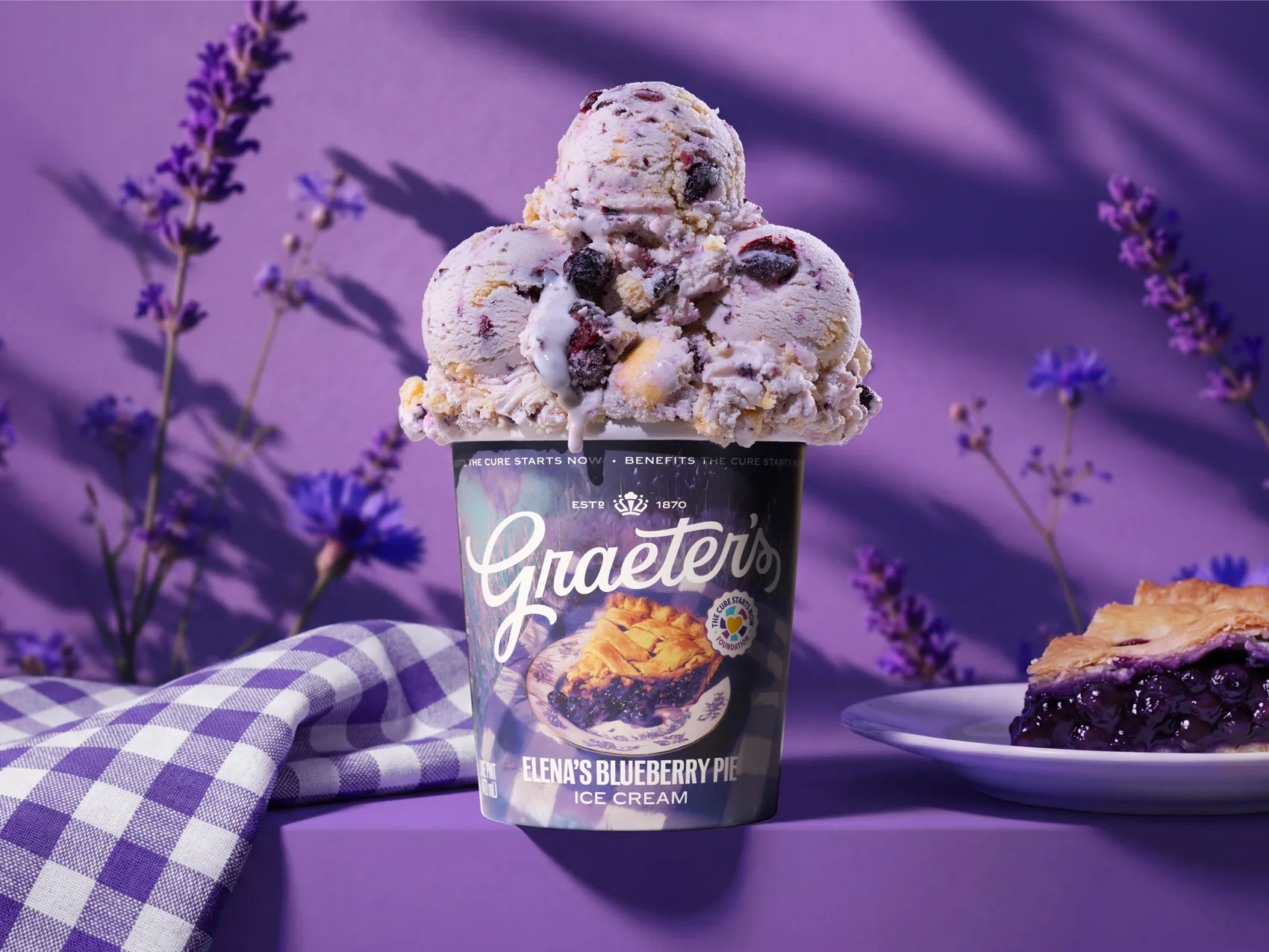 A Graeter’s pint styled with lavender sprigs and pie on a purple backdrop