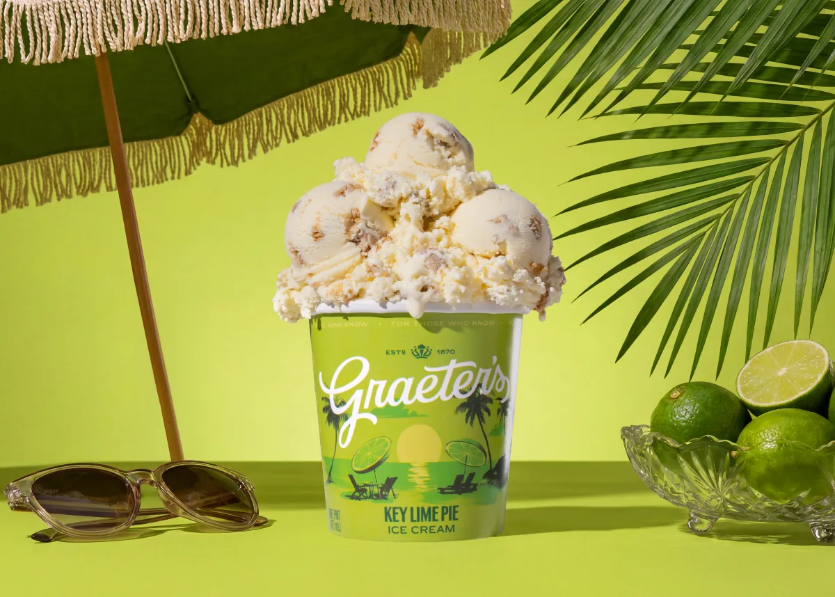 A Graeter’s pint piled high with ice cream under a fringed umbrella