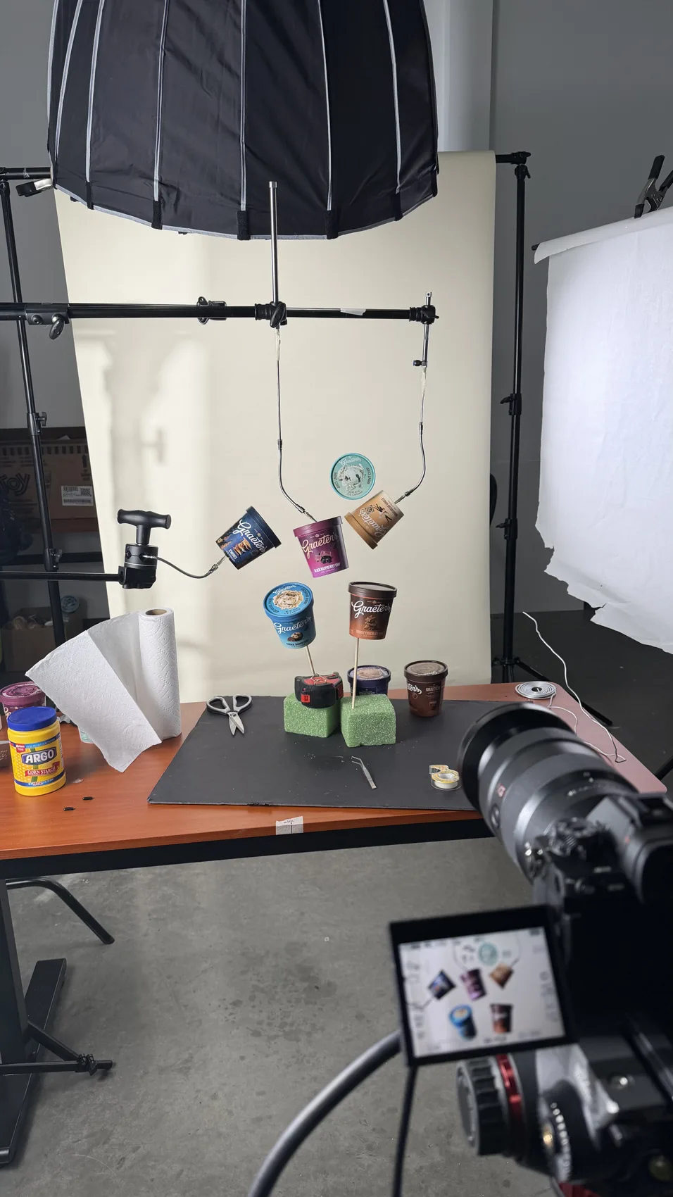 Behind the scenes in the photo studio, lights and set rigged for a shoot