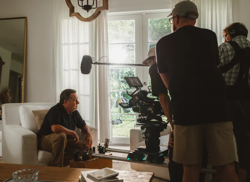 The crew lining up a shot on a video set