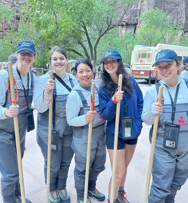 Teammates with hiking poles in Zion National Park